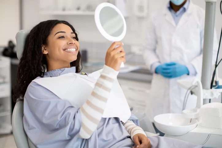 smiling woman checks out her smile